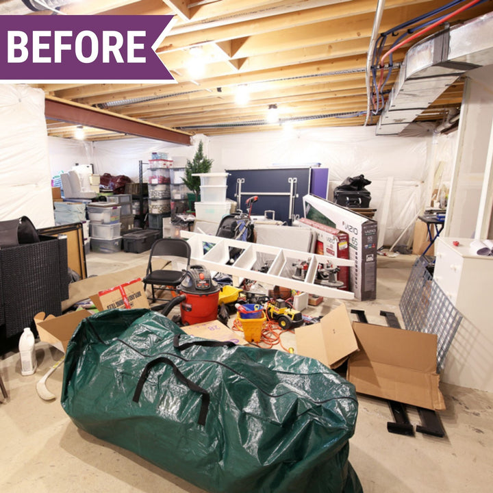 A cluttered basement is ready for transformation, with scattered boxes, bags, a ladder, and toys. Exposed ceiling beams and HVAC ductwork loom over storage bins and exercise equipment. A "BEFORE" label in the upper left corner hints at the impending order brought by Abby Organizes' The Organized Home Method Course.