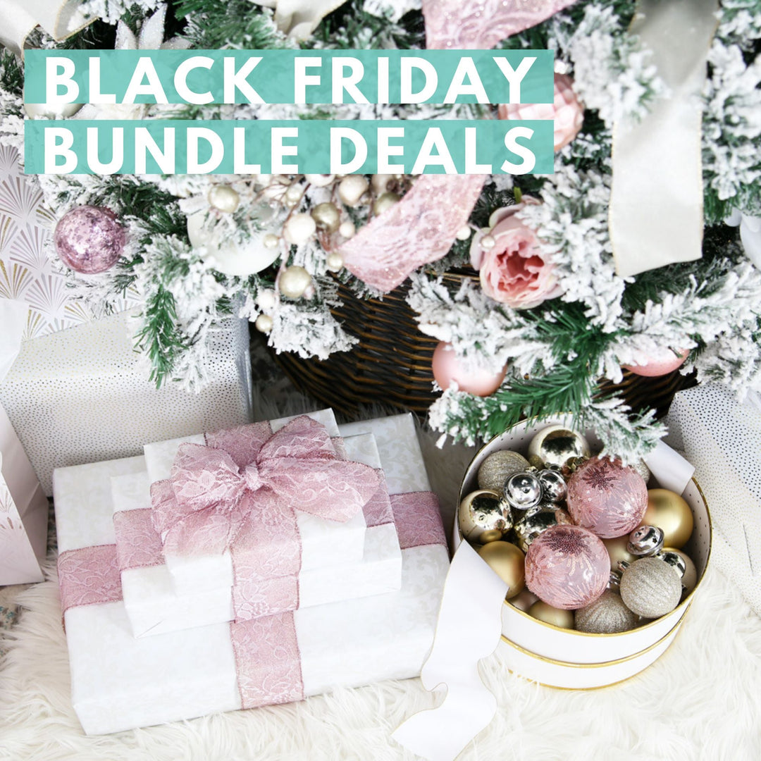 Christmas gifts wrapped in white paper with pink ribbons sit under a decorated, snow-dusted Christmas tree. Text reads "Black Friday Bundle Deals" in bold white letters on a teal background.