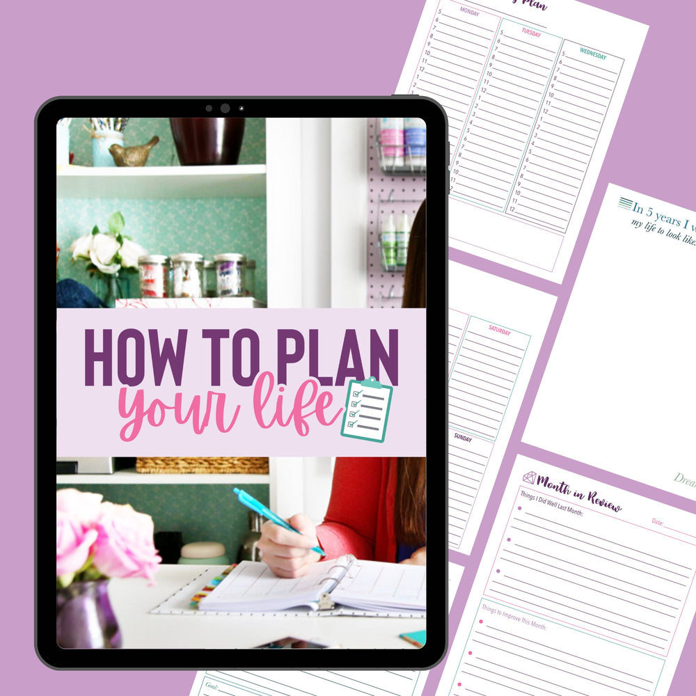 An iPad shows "How to Plan Your Life" and a checklist icon, while Abby Organizes Productivity Power Pack Bundle worksheets with stylish prompts are spread on a purple surface beside someone writing in a planner at a desk with flowers.