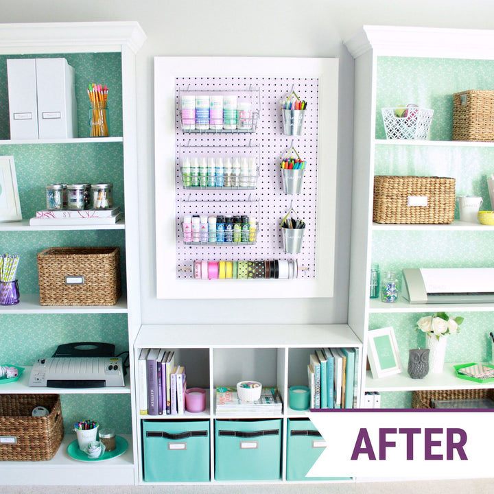 Organized craft room with a pegboard for organizing paint and ribbon and open shelving paired with pretty baskets to store smaller craft supplies